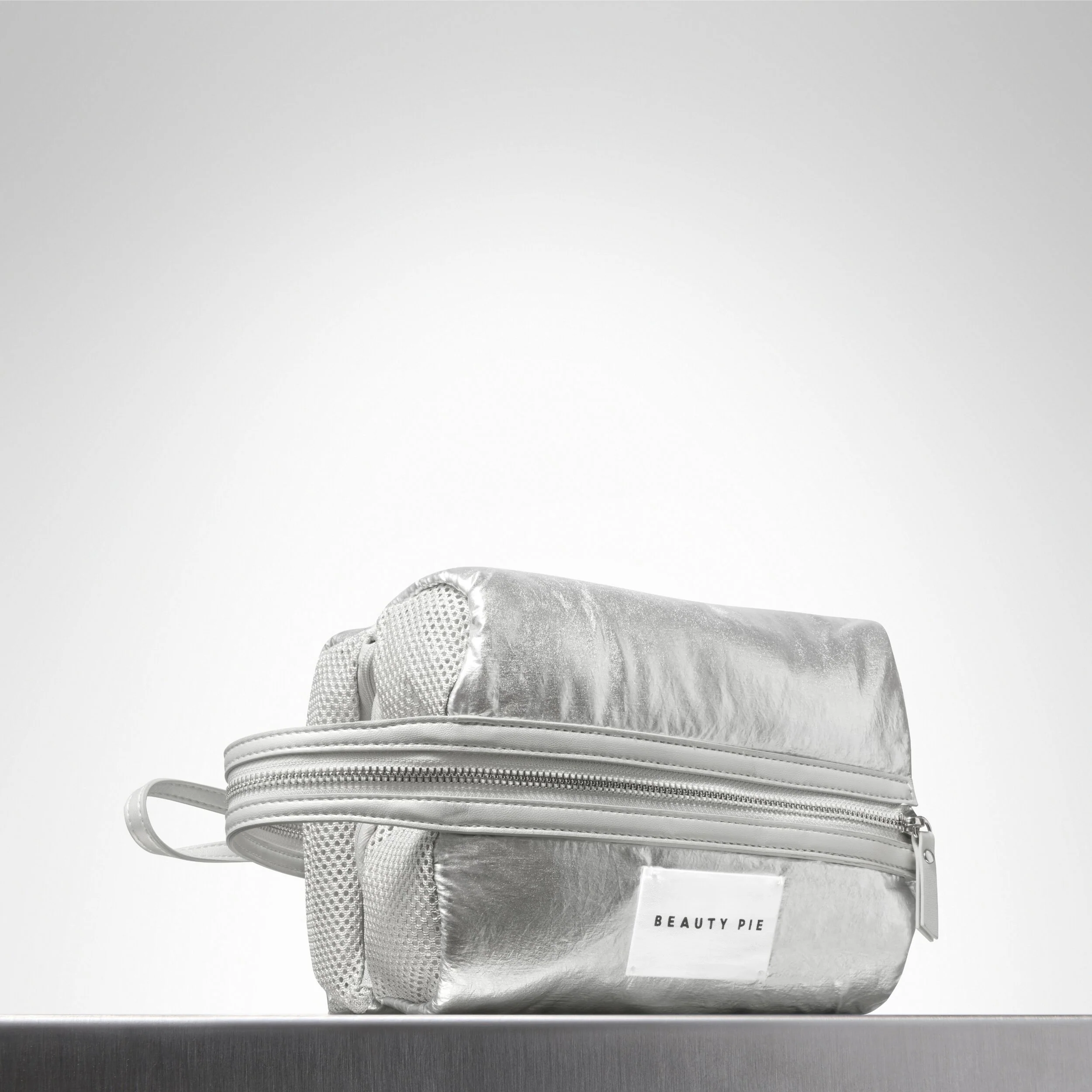 The Perfectly Puffy Silver Organizer Bag with Three Zipped Mesh Compartments