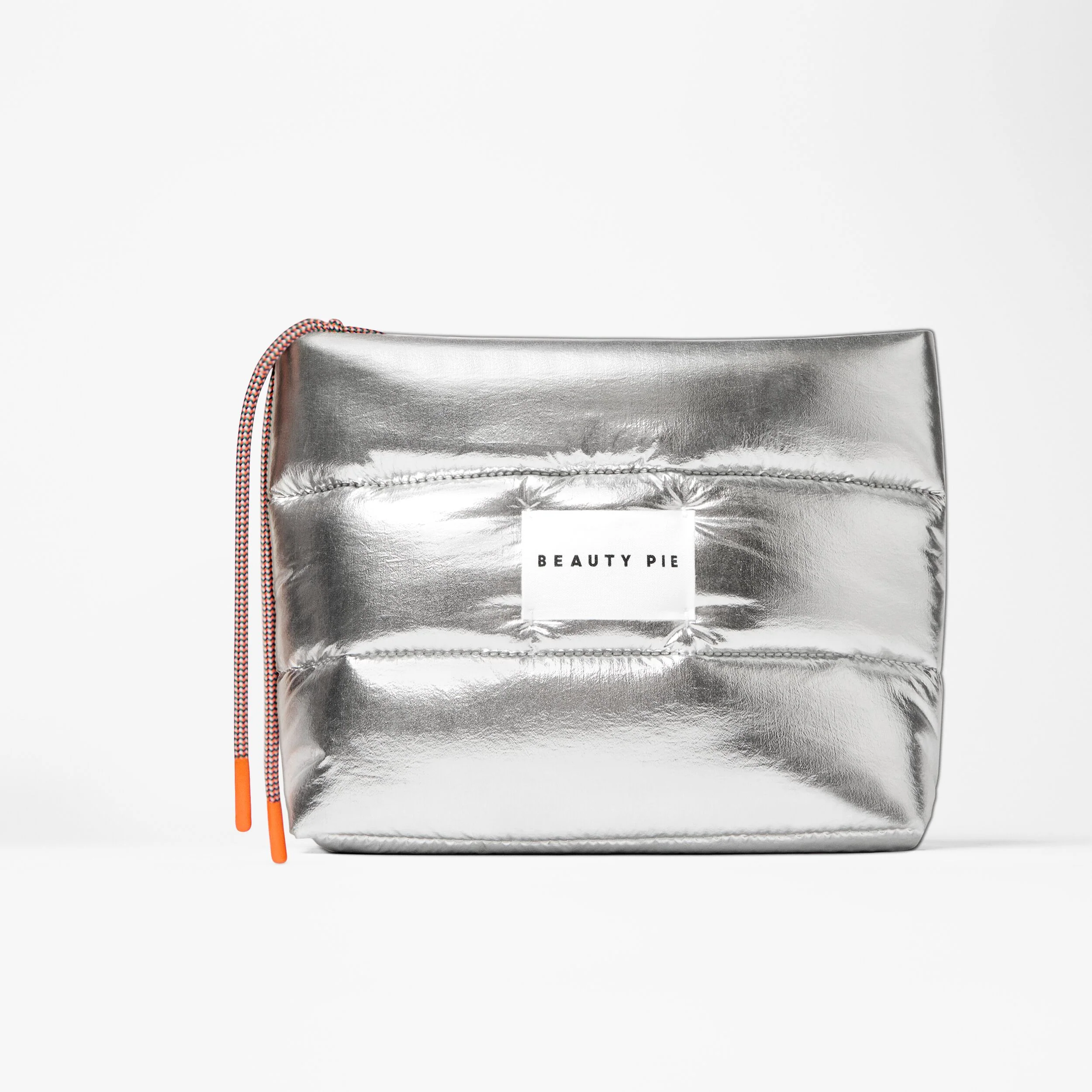 The Perfectly Puffy Silver Beauty Bag in Vegan Materials with Orange Zip-Pull